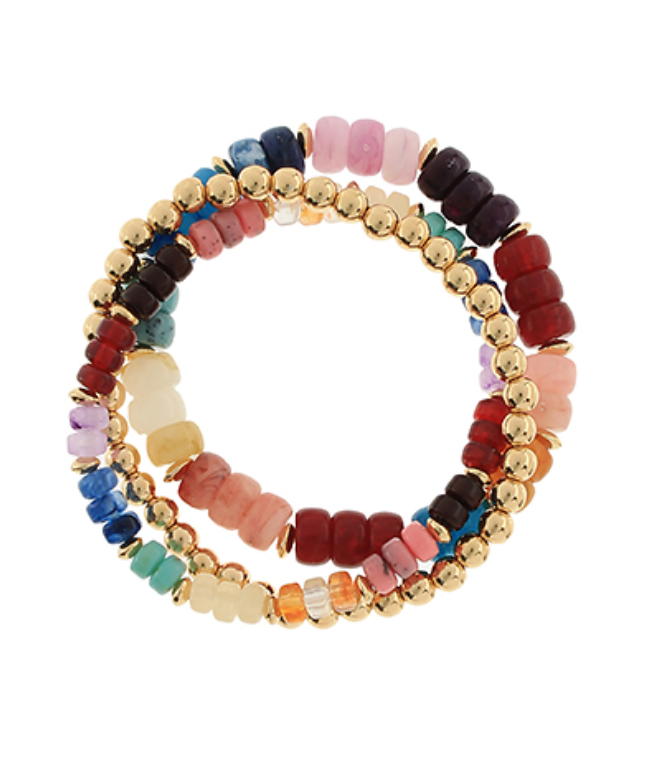 A vibrant set of three stretch bracelets featuring a mix of colorful, multi-shaped beaded strands, including gold-toned spherical beads and various shades of pastel and earthy-toned flat and rounded beads.