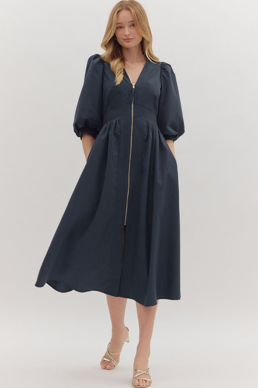 The Liora 3/4 Sleeve Midi Dress features a smocked waistband and front zipper closure for a flattering, comfortable fit.


