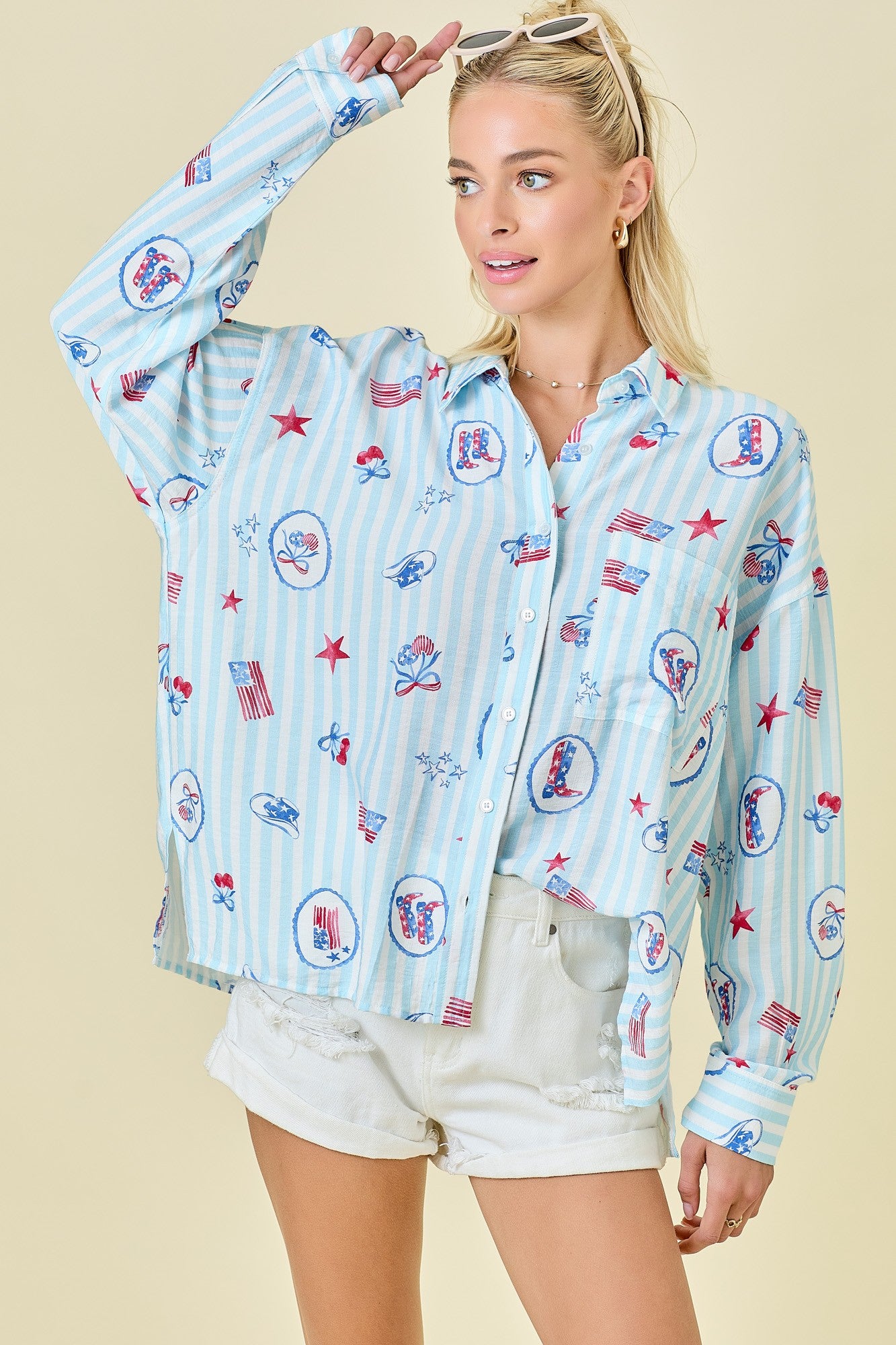 The Lucinda Shirt channels effortless Americana style with classic red, white, and blue stripes, a collared neckline, and an easy button-down fit.

