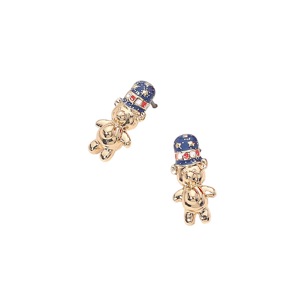 The Maisie Earrings bring patriotic cheer with glittered enamel teddy bears wearing American flag top hats—adorable, festive, and fun-sized.