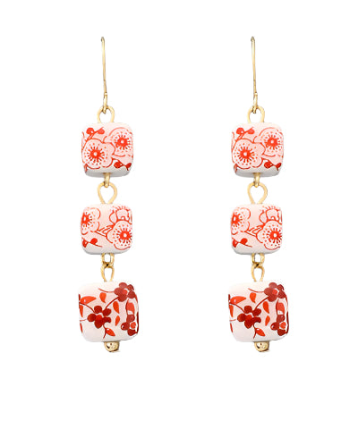 The Maribel Earrings feature bold printed ceramic squares with a lightweight drop design—colorful, artsy, and easy to wear.

