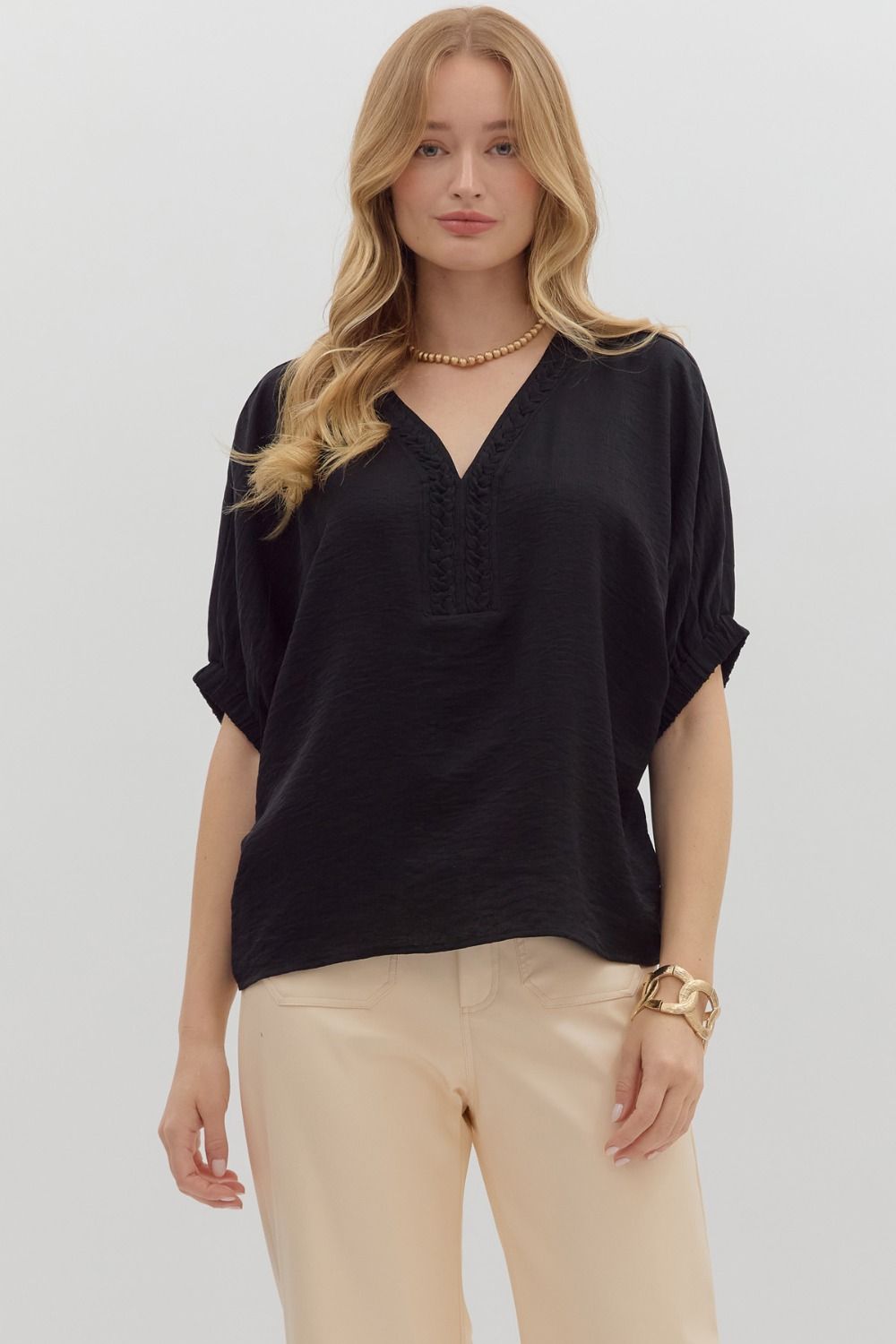 The Nadine Top features an airy dolman silhouette with a unique trenza-detailed V-neckline. Lightweight and effortless, it’s the perfect blend of comfort and elevated style.