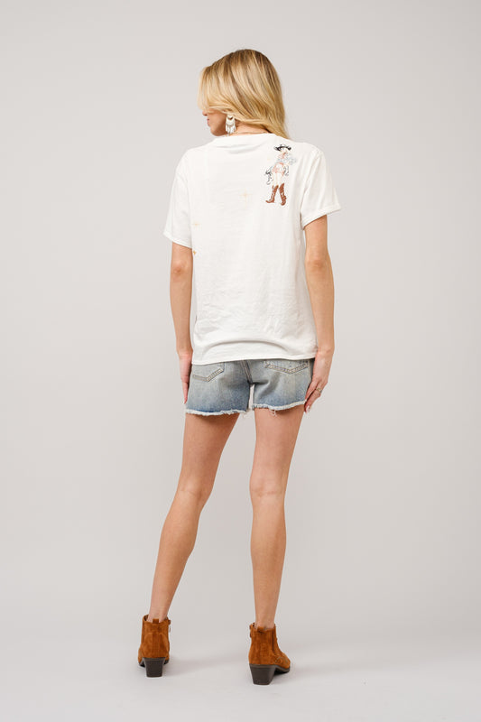 The Odessa Tee features vintage-inspired cowgirl embroidery and retro print details for a playful nod to mid-century Western flair.