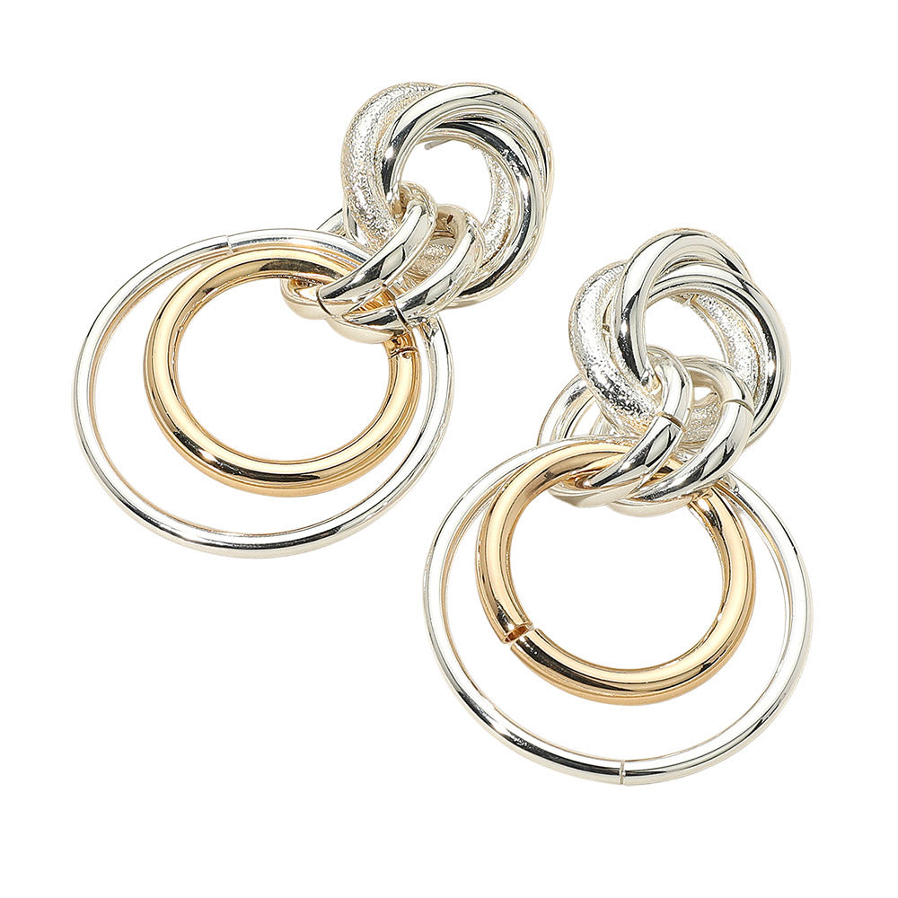 The Ramona Earrings make a bold statement with chunky, interlocking hoops in a modern two-tone finish—perfect for layered shine and standout style.
