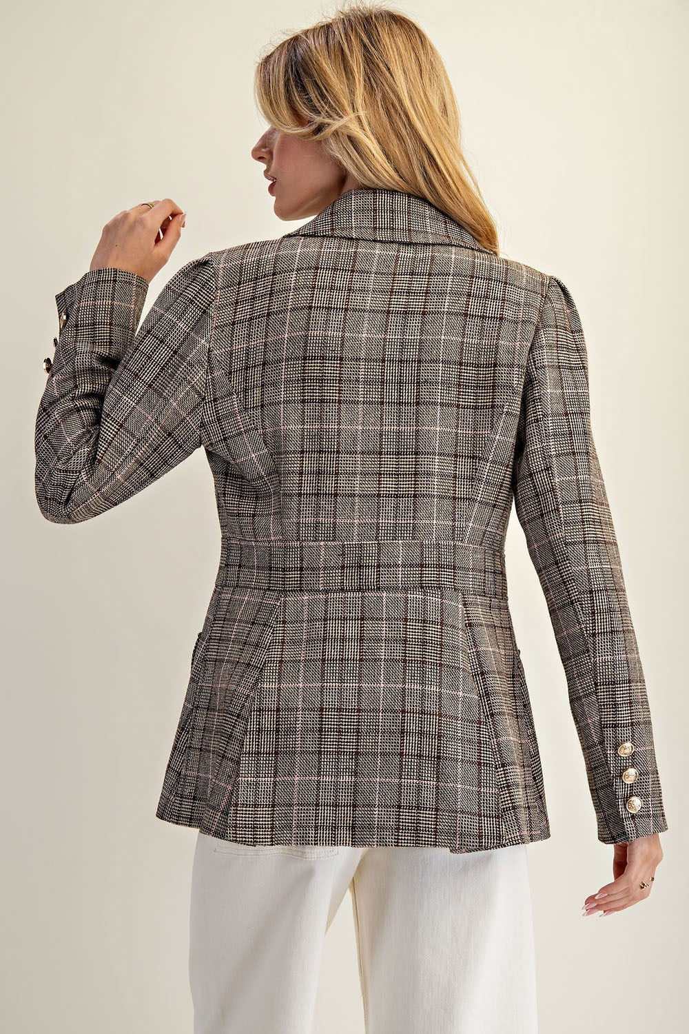 The Renata Blazer features a tailored plaid silhouette with gold button details—an elevated essential for modern, polished styling.

