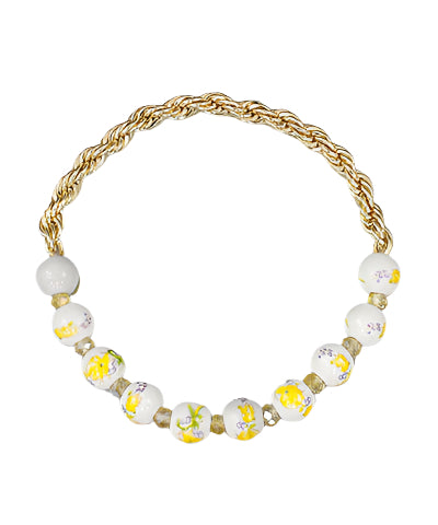 The Thea Bracelet features a mix of ceramic beads, glass accents, and metallic rope chain—an effortlessly boho-chic piece with stretch for comfort.