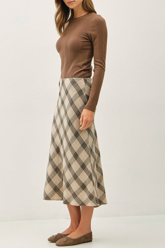 The Vera Skirt features a pull-on fit and flare silhouette with a high-rise waist and soft stretch for all-day comfort.