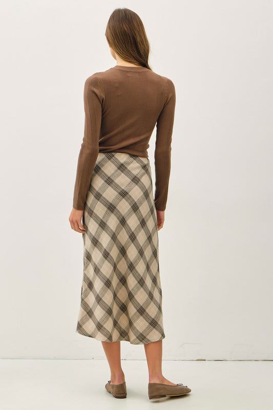 The Vera Skirt features a pull-on fit and flare silhouette with a high-rise waist and soft stretch for all-day comfort.
