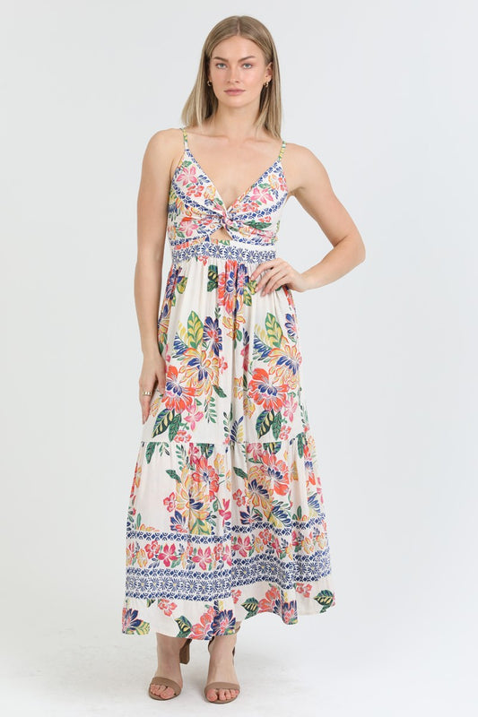  floral print maxi dress with a twist-front bodice and flowing tiered skirt, perfect for summer.