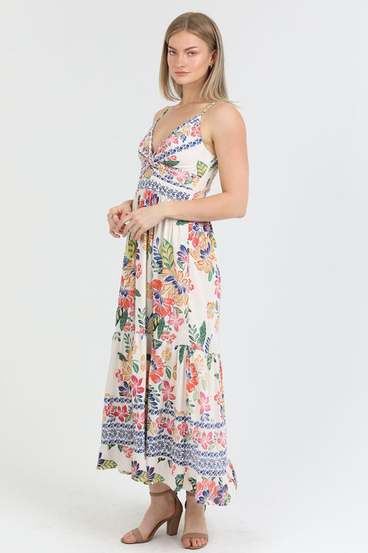  floral print maxi dress with a twist-front bodice and flowing tiered skirt, perfect for summer.