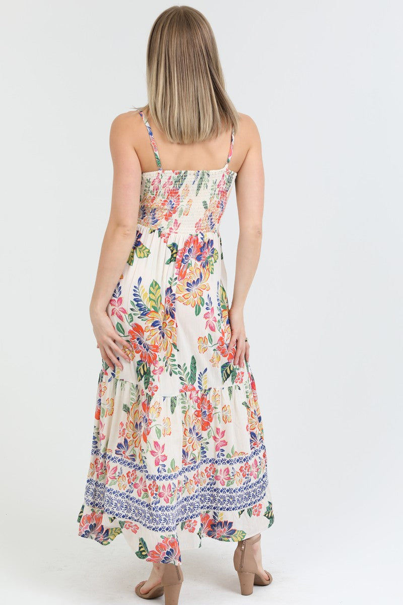  floral print maxi dress with a twist-front bodice and flowing tiered skirt, perfect for summer.