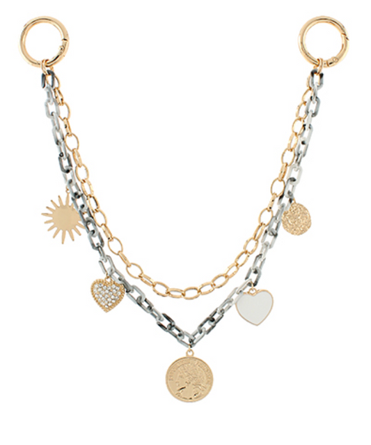 A two-layered shoulder bag strap featuring a mix of gold-toned and silver-toned chunky chains adorned with various gold-toned charms including a sun, a textured heart, a solid white heart, and a coin with a profile, attached to a large O-ring on each end.