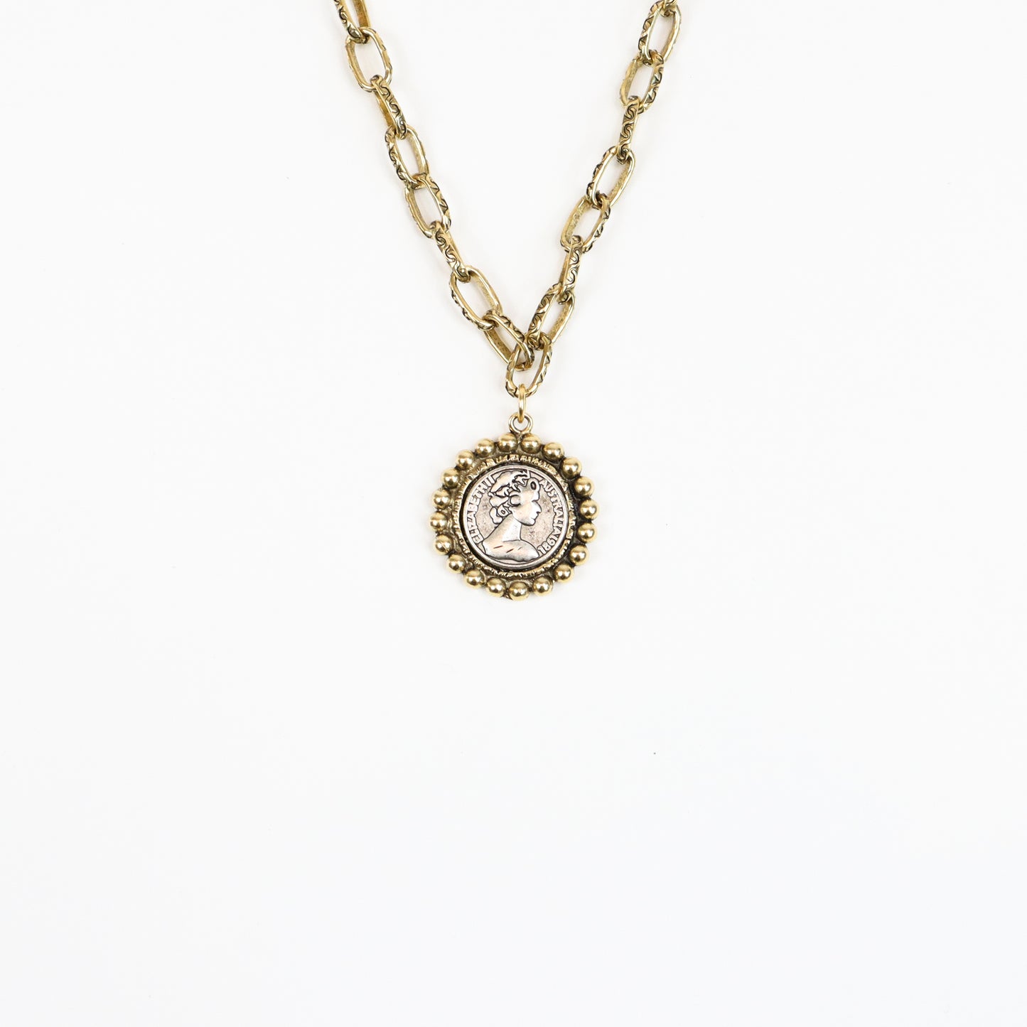 A 22K gold-plated Victorian-inspired medallion necklace featuring an antique-style cameo coin pendant with a beaded frame, suspended on a textured gold chain for a regal, vintage look.