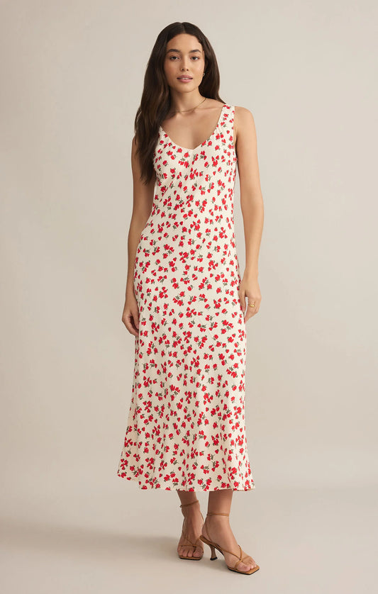 Flowy ivory maxi dress with red ditsy floral print, scoop neckline, and a relaxed fit—perfect for summer elegance and effortless chic style.