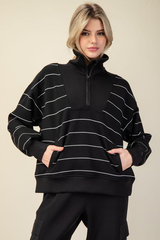 A silky-soft striped pullover with a mock neck, quarter zip, and kangaroo pocket for effortless comfort and style.