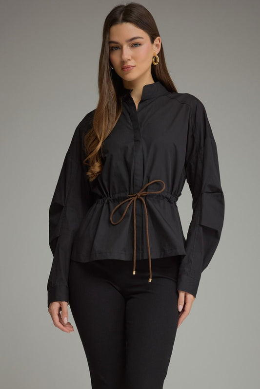 A polished 100% cotton long sleeve top featuring a sophisticated high neckline, adjustable drawstring waist, and button cuffs.

