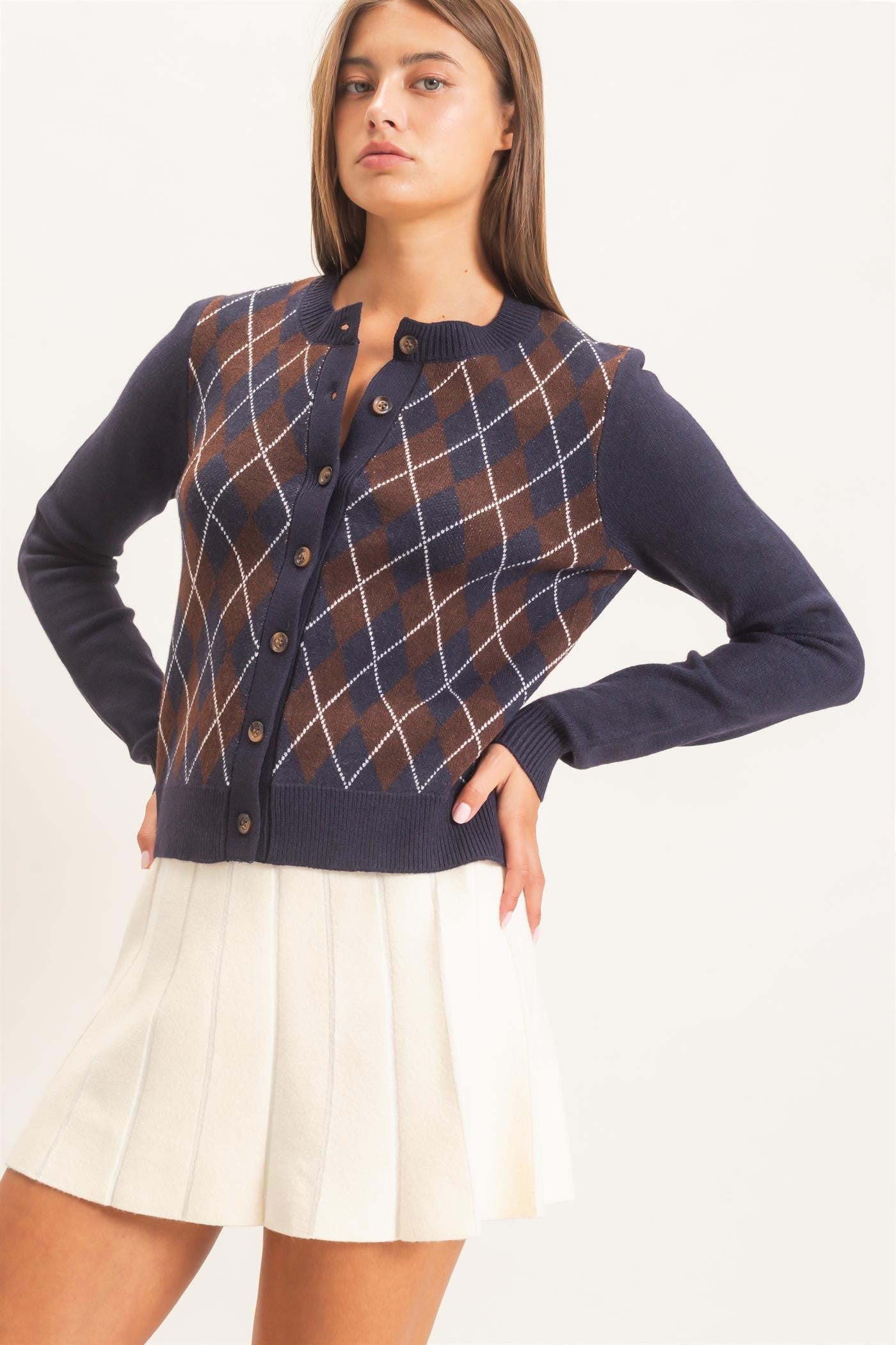A timeless argyle cardigan with a relaxed silhouette, ribbed crew neckline, and classic button-front closure for polished, effortless layering.