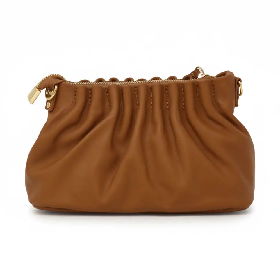 A brown leather shoulder bag with a gathered, pleated top edge and gold-tone hardware, shown against a plain white background.