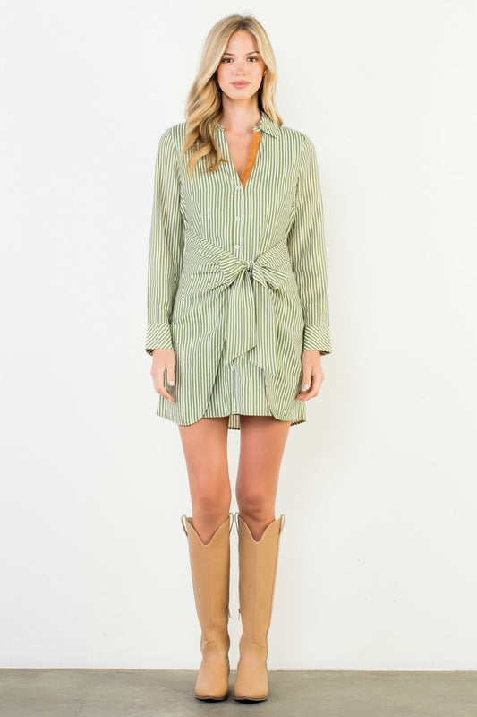 A fresh twist on the classic shirt dress — refined stripes meet a playful front-tie detail for an effortlessly chic silhouette.