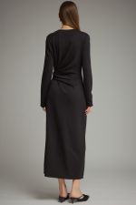 A sleek and effortlessly flattering long sleeve midi dress featuring a soft knit feel, adjustable side-tie waist, and chic side slit.