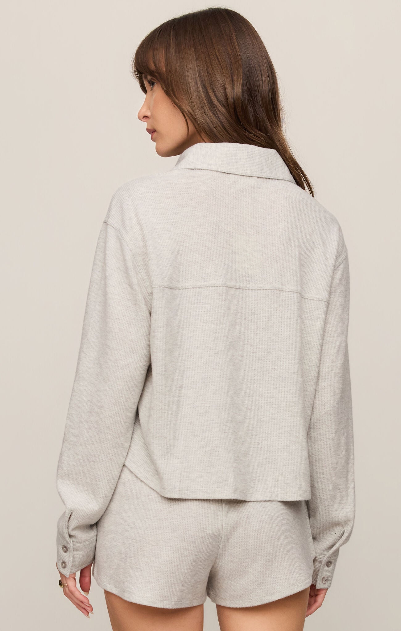 A cozy brushed thermal top featuring a classic collar, button-front design, and soft stretch fabric for effortless everyday comfort.

