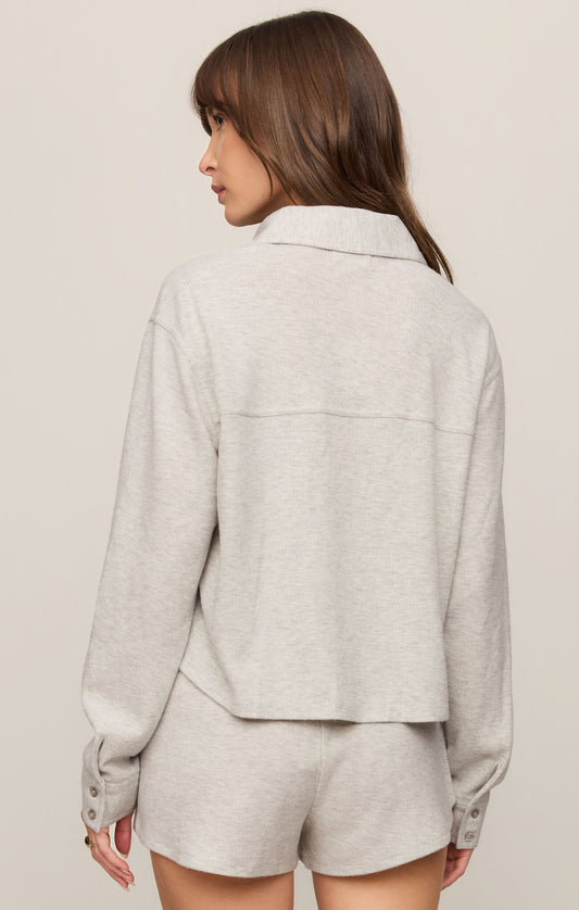 A cozy brushed thermal top featuring a classic collar, button-front design, and soft stretch fabric for effortless everyday comfort.
