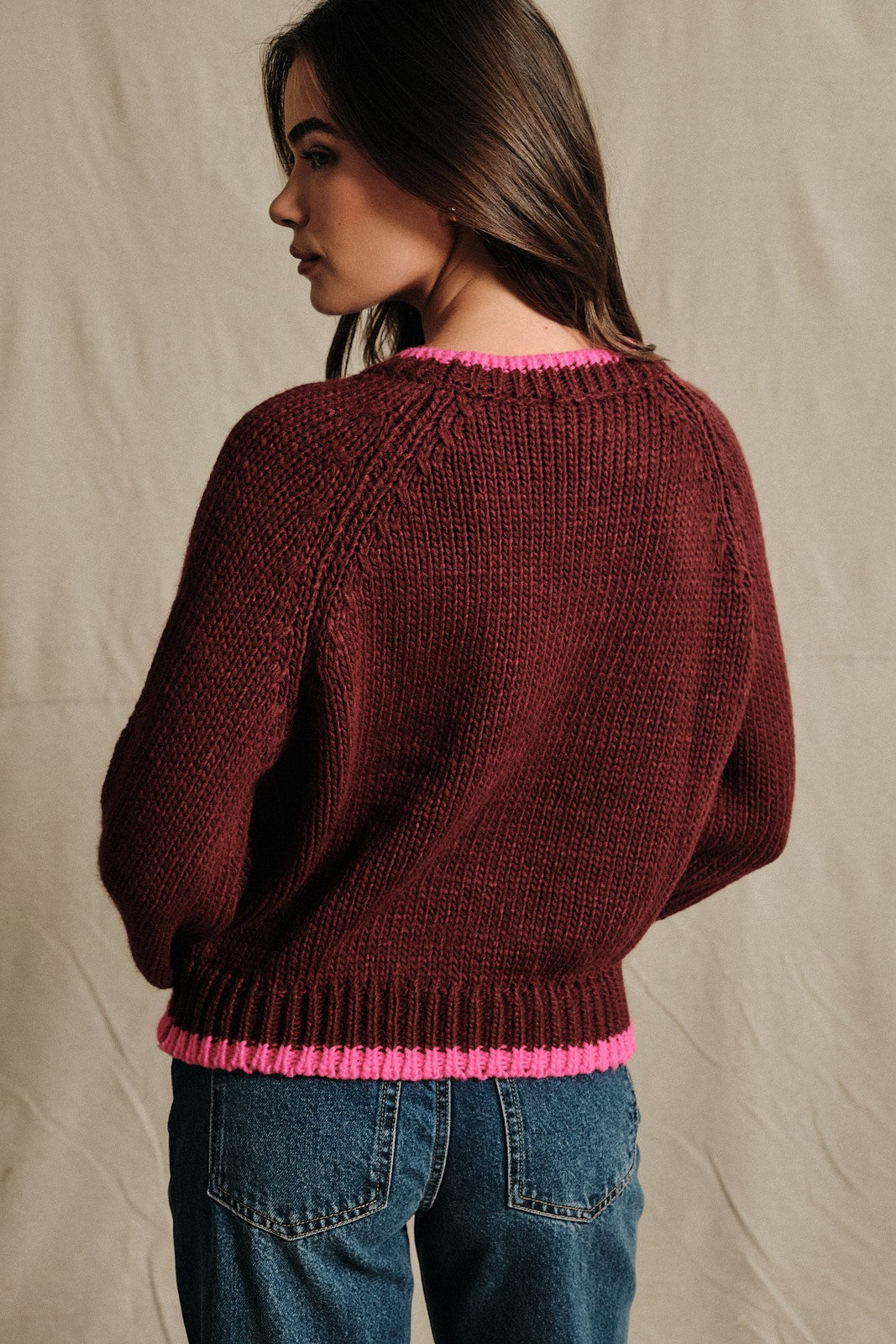 A chunky knit pullover with bold statement lettering and contrast ribbed trim for a cozy, après-ski-inspired look all winter long.

