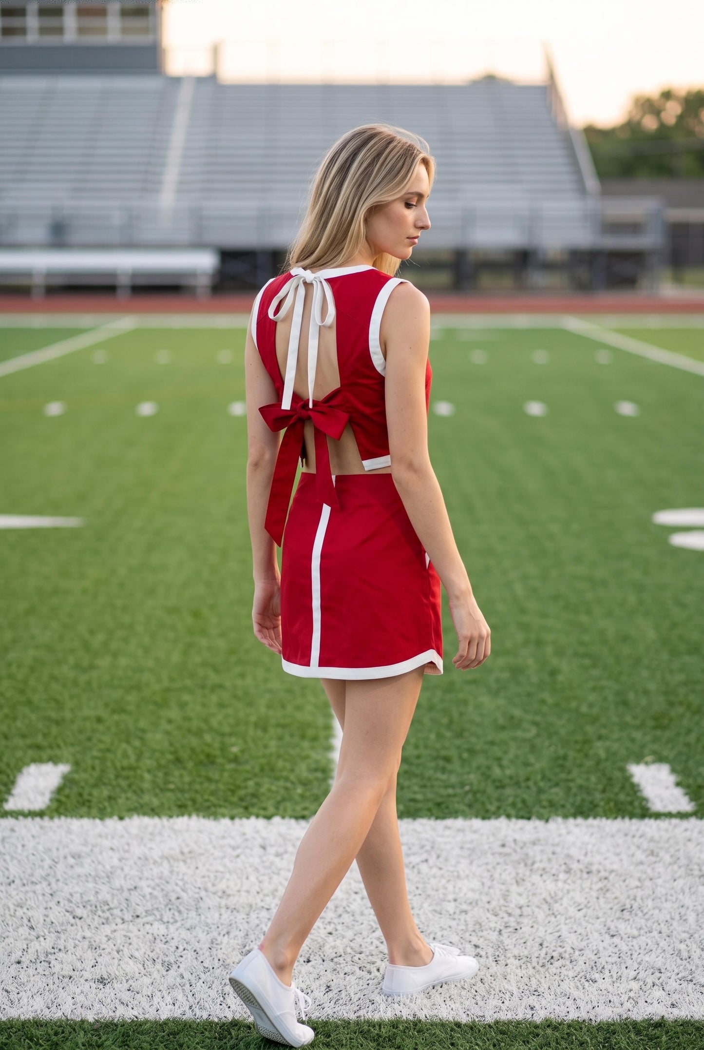 Rosalind Contrast Band Crop Top and Skort Set featuring a sleeveless crop top with contrast band detailing, open tie-back bow closure, and coordinating tailored mini skort