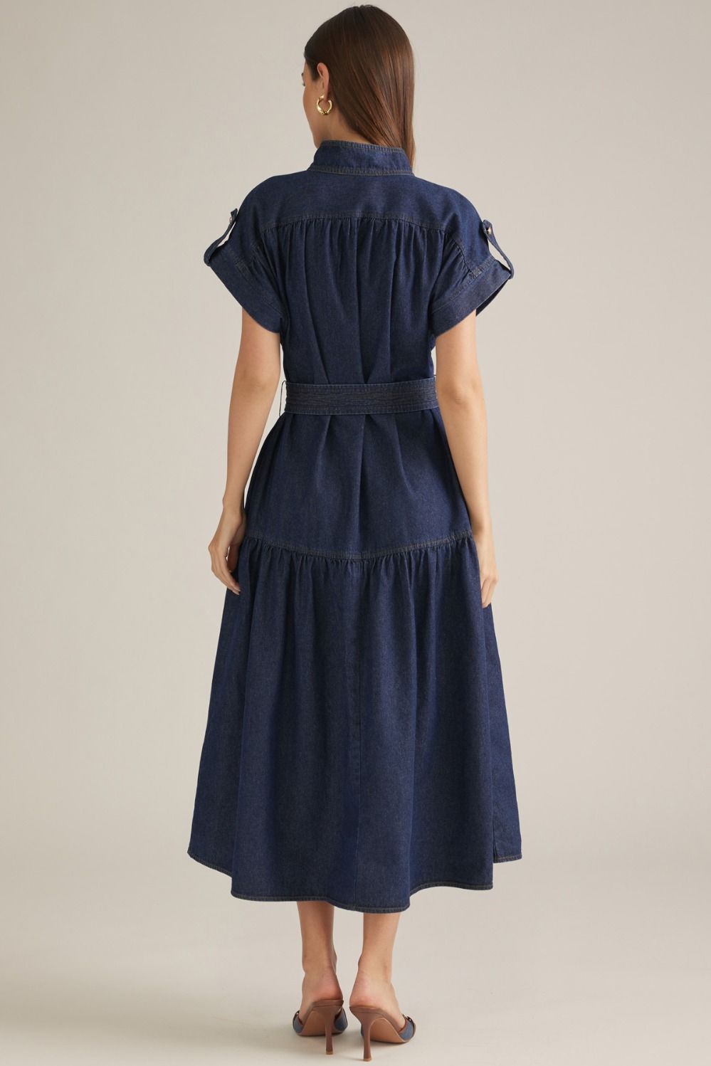 A timeless solid midi dress featuring a structured stand collar, cap sleeves, partial button front, and self-tie waist for an effortlessly polished silhouette.