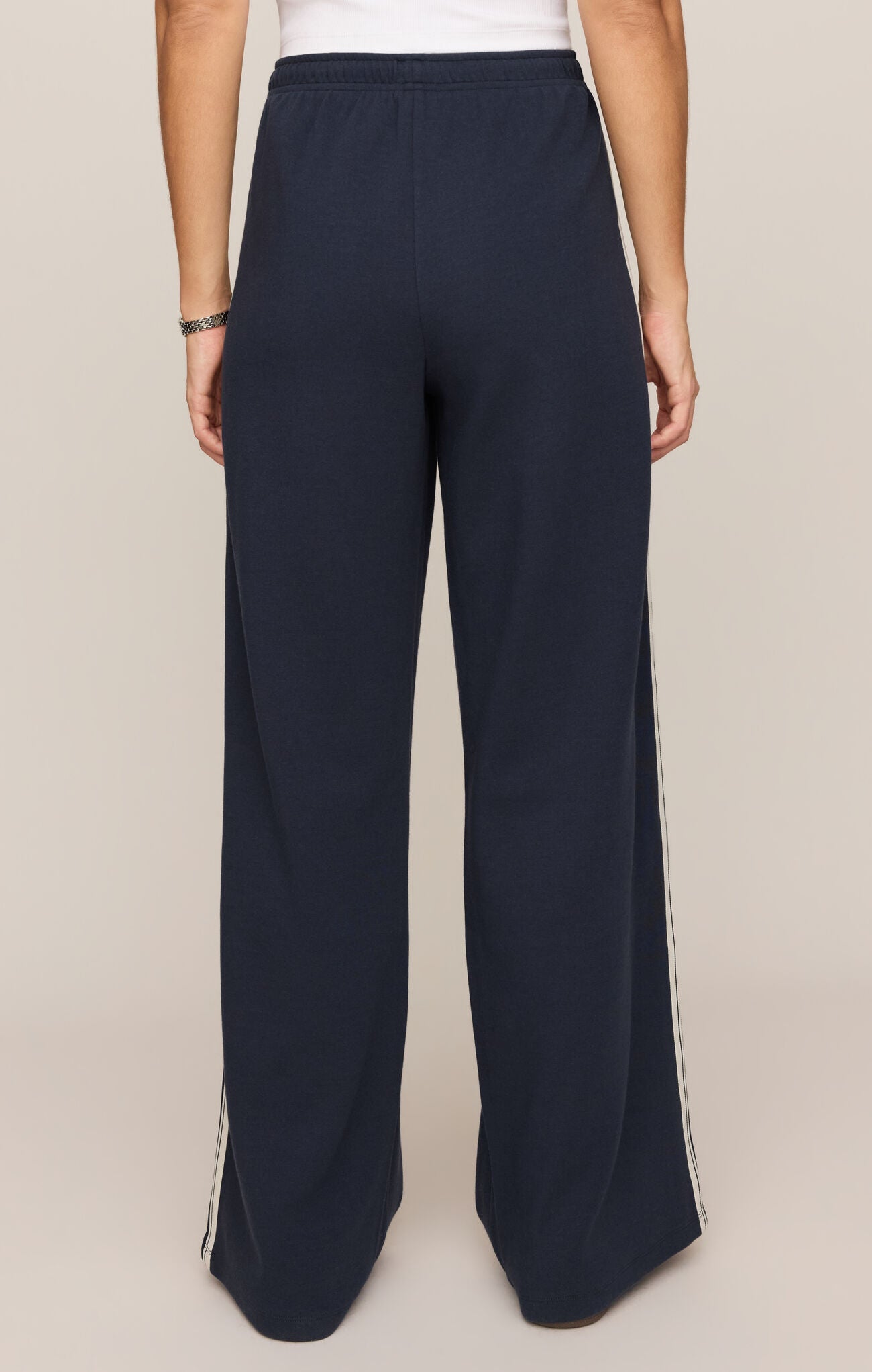 Effortlessly polished and incredibly comfortable, these high-rise knit lounge pants feature a relaxed silhouette, adjustable drawcord waist, and functional pockets for everyday versatility.
