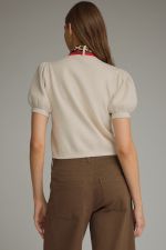 The Beatrice Knit Top adds a chic twist to everyday style with feminine puff sleeves and a versatile detachable scarf neckline detail.