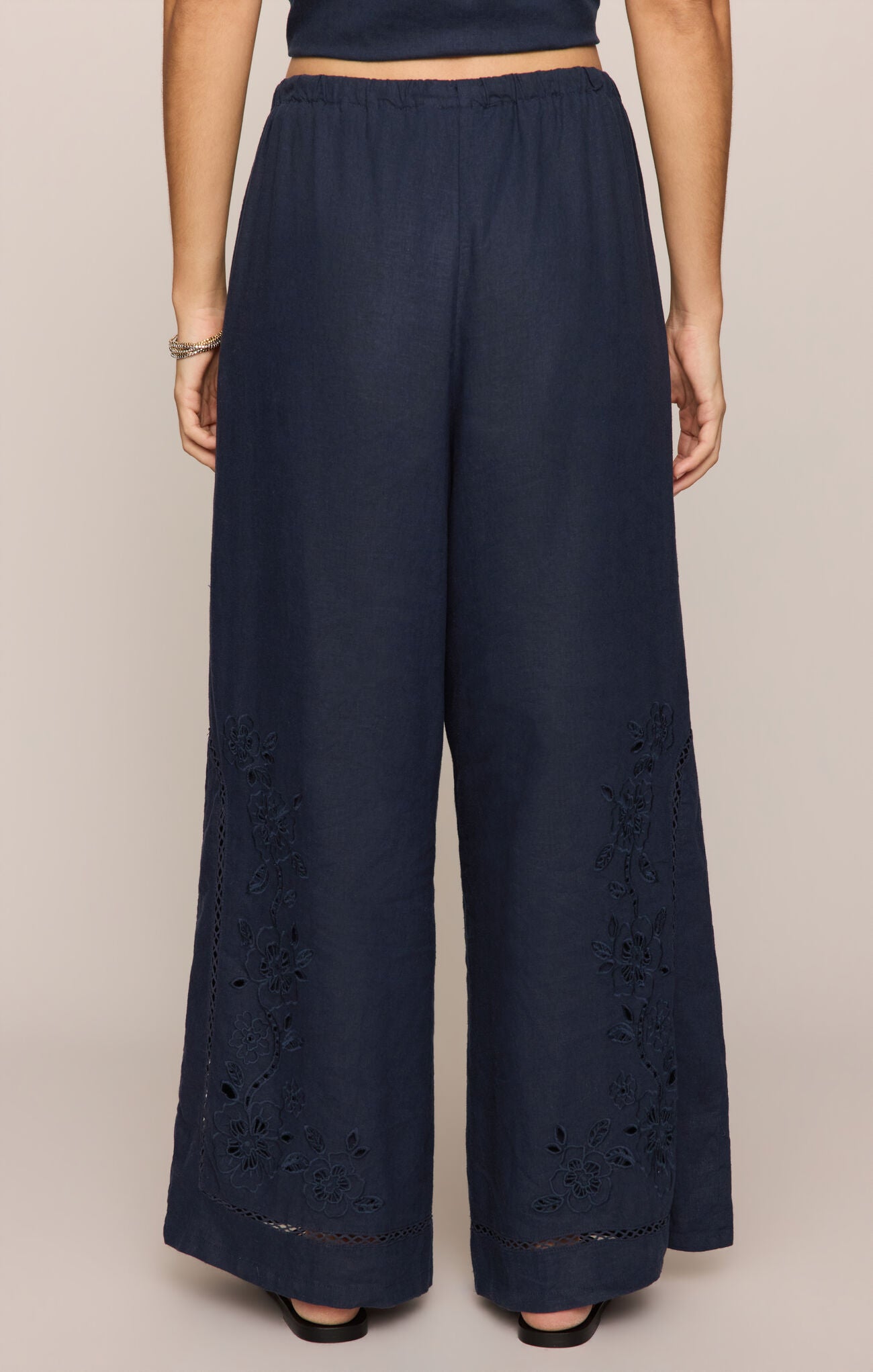 Navy blue wide-leg pants with lace detailing 