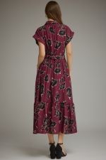 A feminine floral midi dress featuring a button-front bodice, adjustable self-tie waist, and flowing silhouette for timeless everyday elegance.
