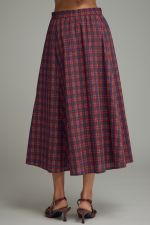 A timeless plaid midi skirt featuring flattering gathered detail, a comfortable elastic-back waist, and practical side pockets.
