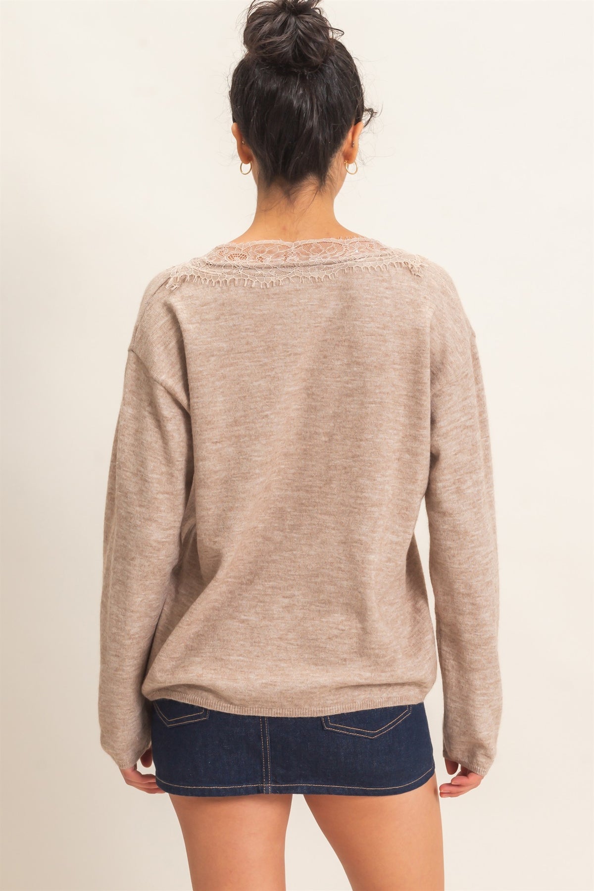 A feminine lace trim V-neck sweater featuring a relaxed silhouette, soft knit fabric, and elegant details for effortless everyday style.
