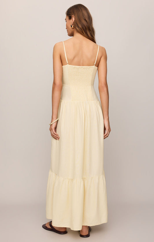 A breezy linen-blend maxi dress featuring a flattering square neckline, adjustable spaghetti straps, and an effortlessly elegant silhouette made for sunny days.