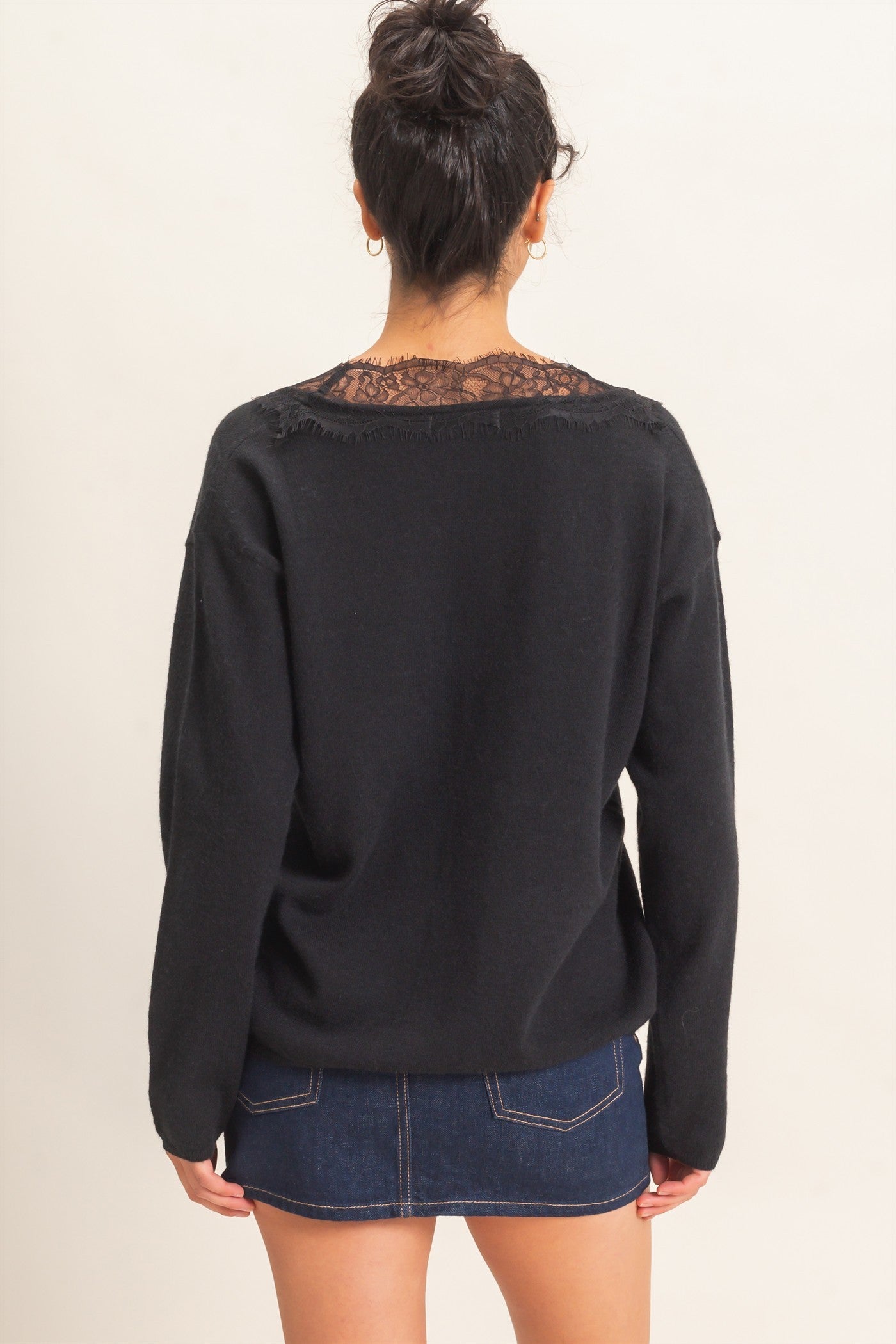 A feminine lace trim V-neck sweater featuring a relaxed silhouette, soft knit fabric, and elegant details for effortless everyday style.