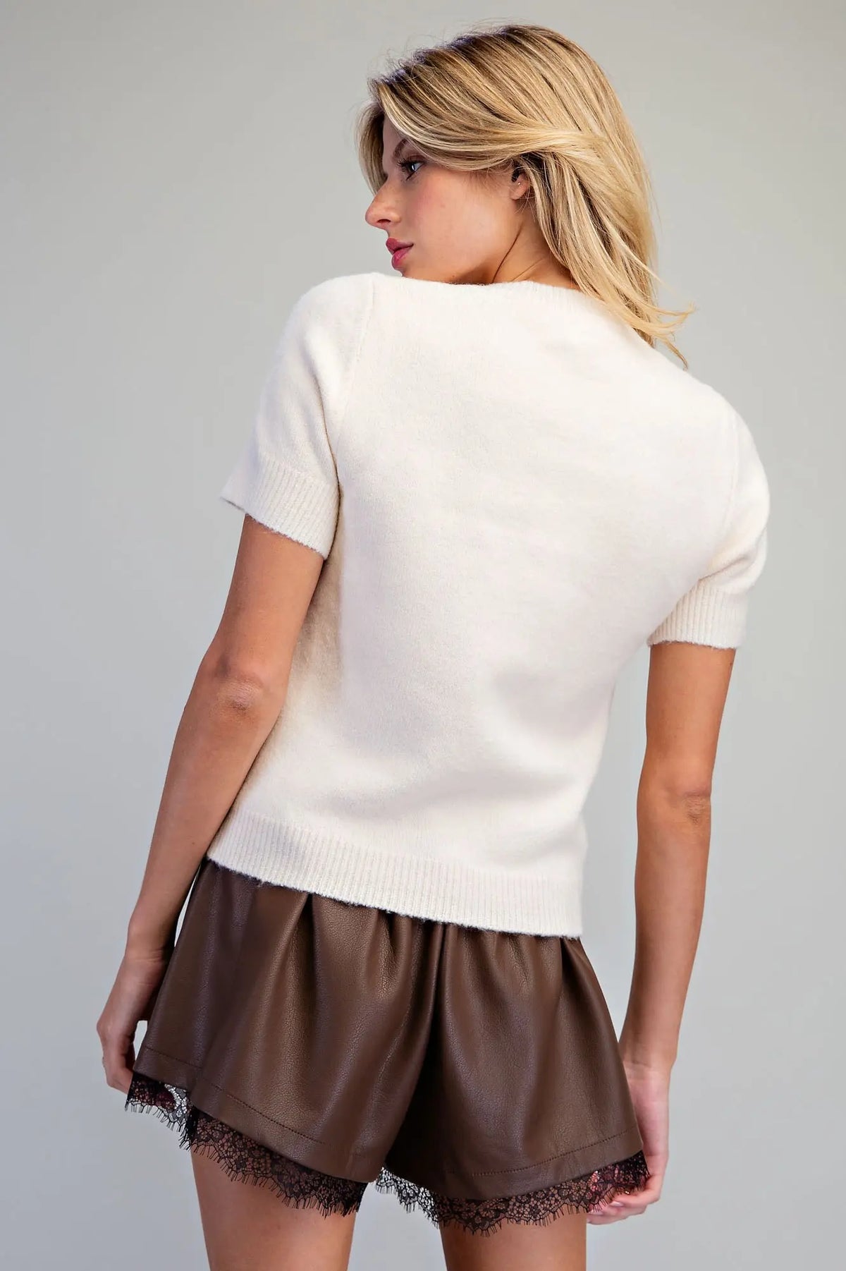 Raise a glass to effortless style with this ultra-soft knit sweater featuring sparkling "Martini" rhinestone lettering and a chic cocktail glass design.