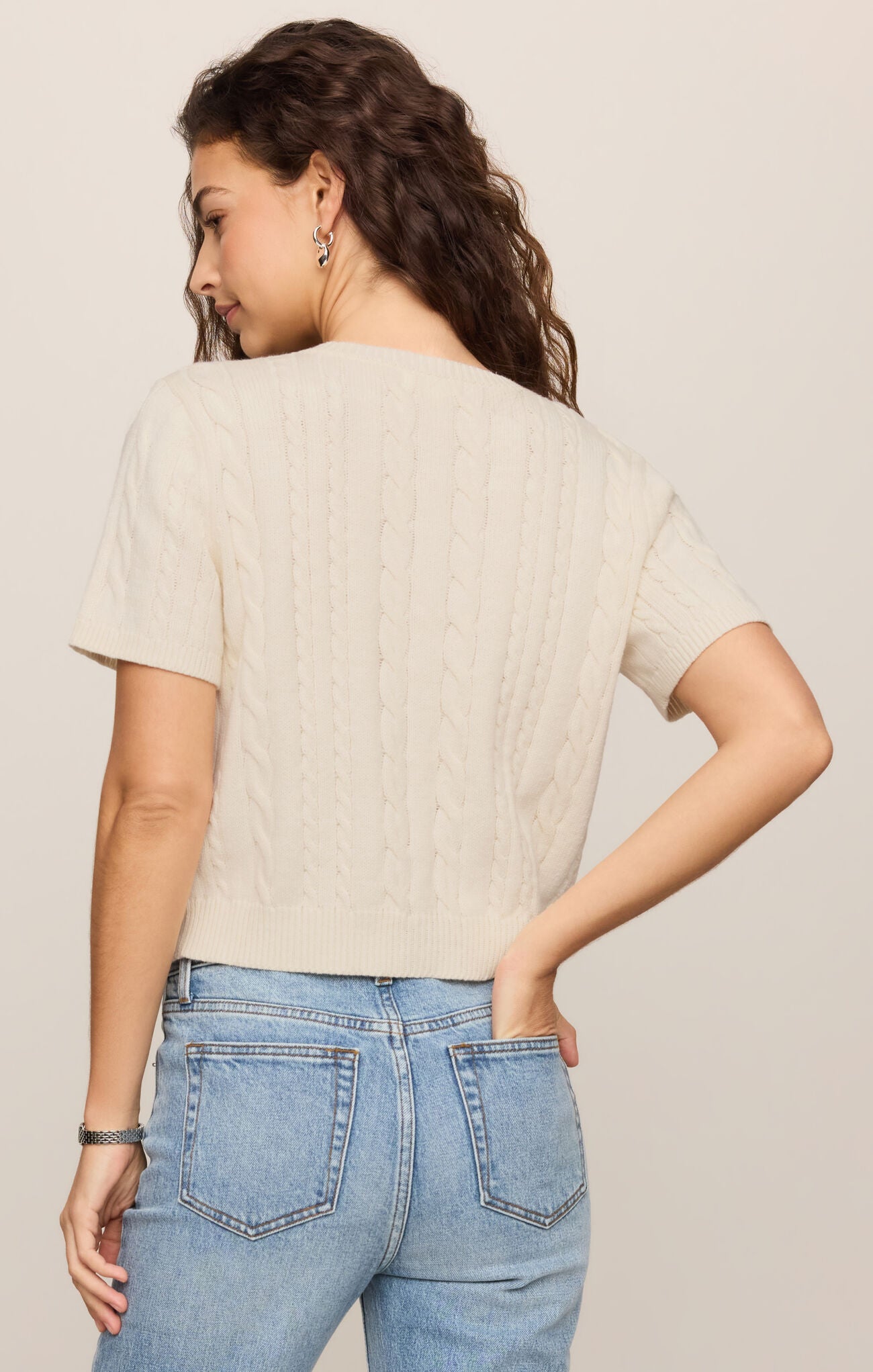 back of cable knit button-front top featuring a classic crew neckline