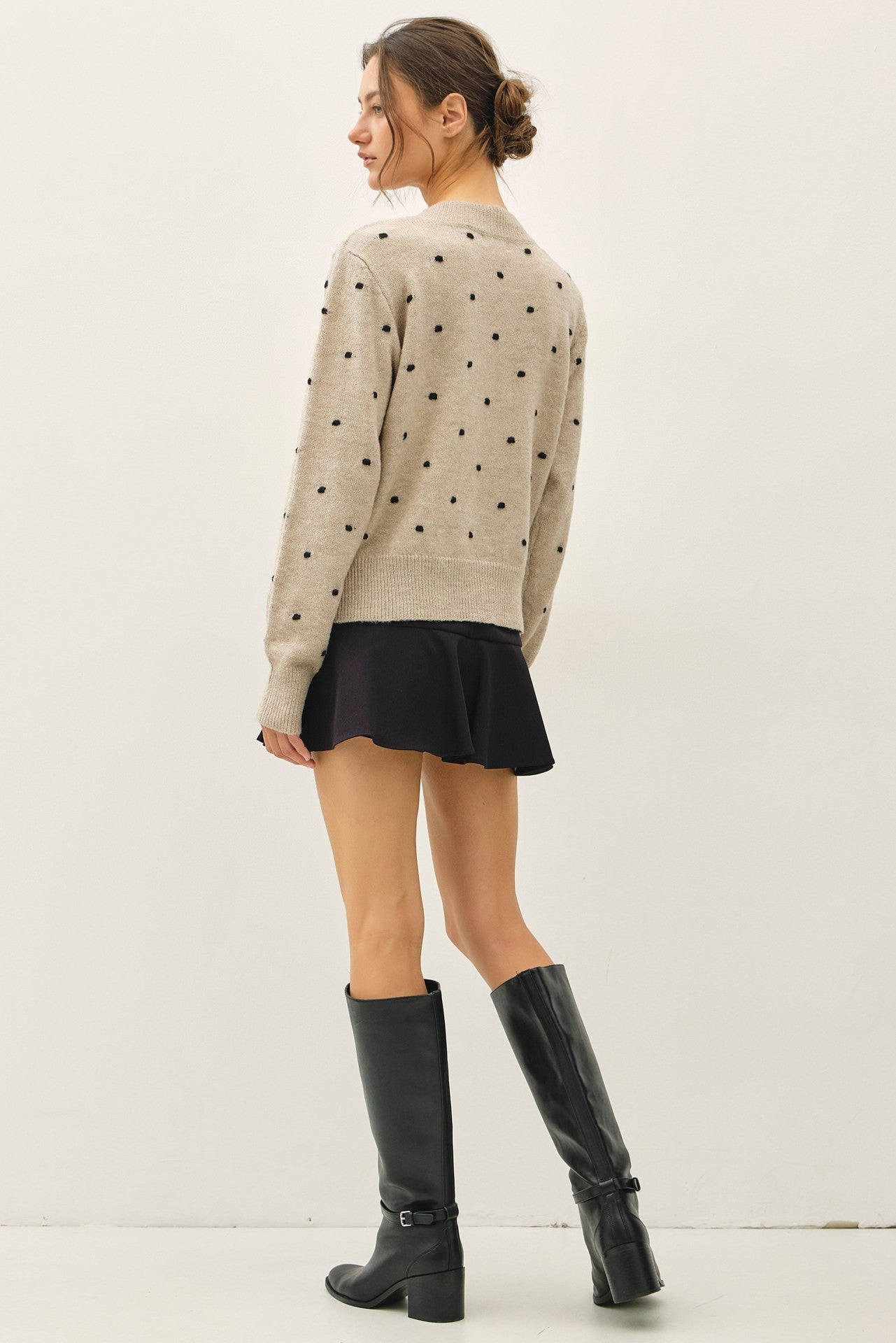 back of oatmeal knit sweater with black polka dots, crewneck long sleeve 