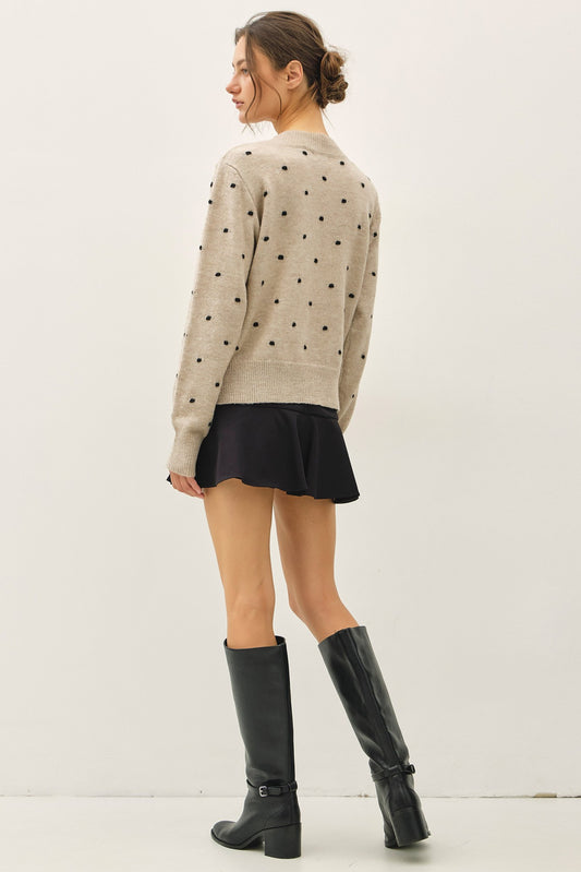 back of oatmeal knit sweater with black polka dots, crewneck long sleeve 