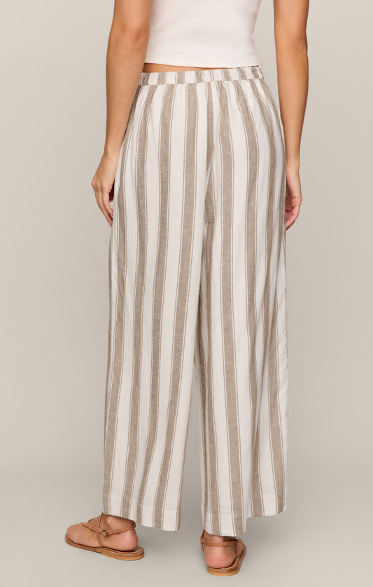 Effortlessly chic and breathable, these striped linen-blend pants feature a high-rise fit, adjustable drawcord waist, and relaxed ankle-length silhouette.