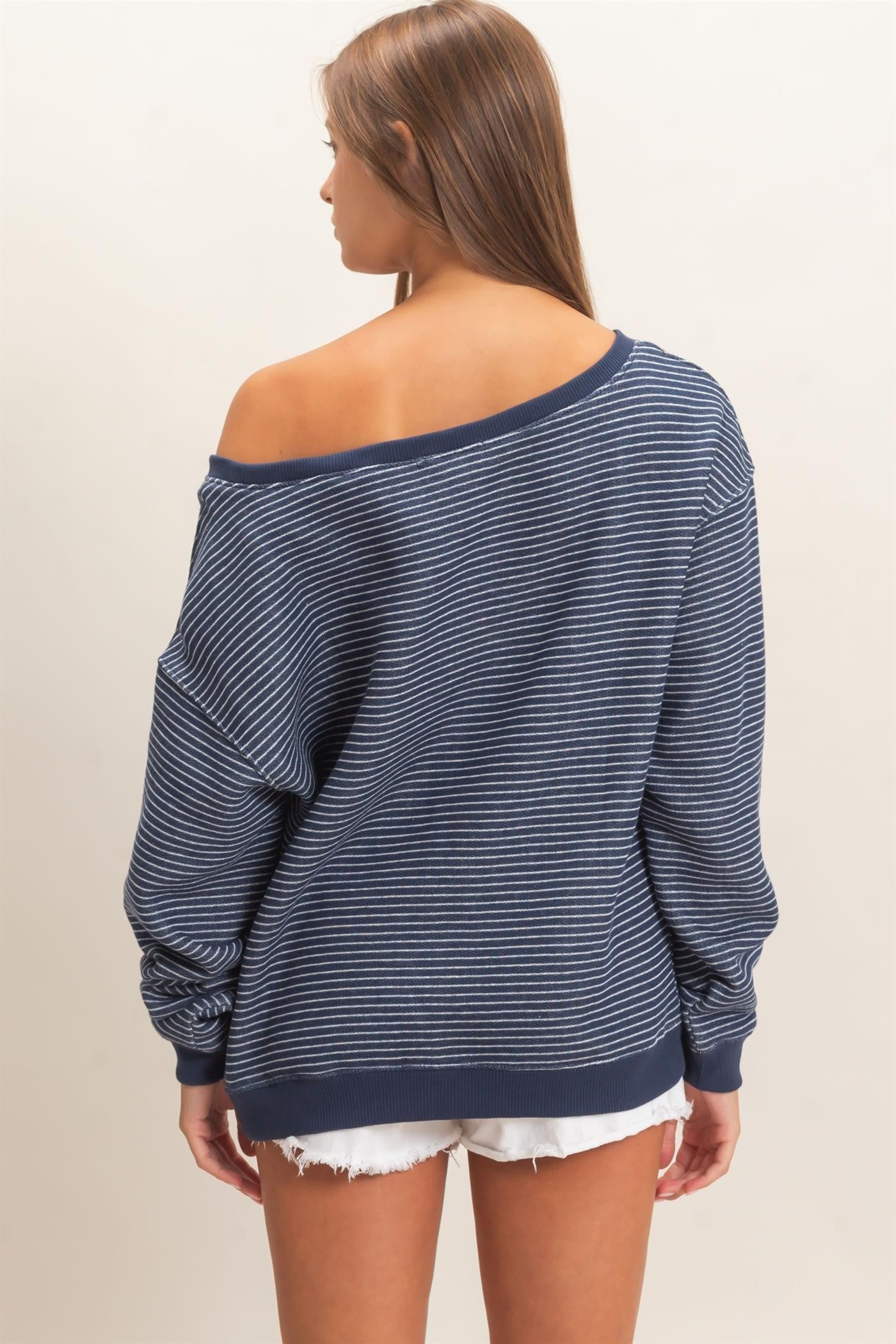 Cozy meets chic in this oversized French terry sweatshirt featuring an off-the-shoulder neckline, relaxed fit, and effortless striped style.