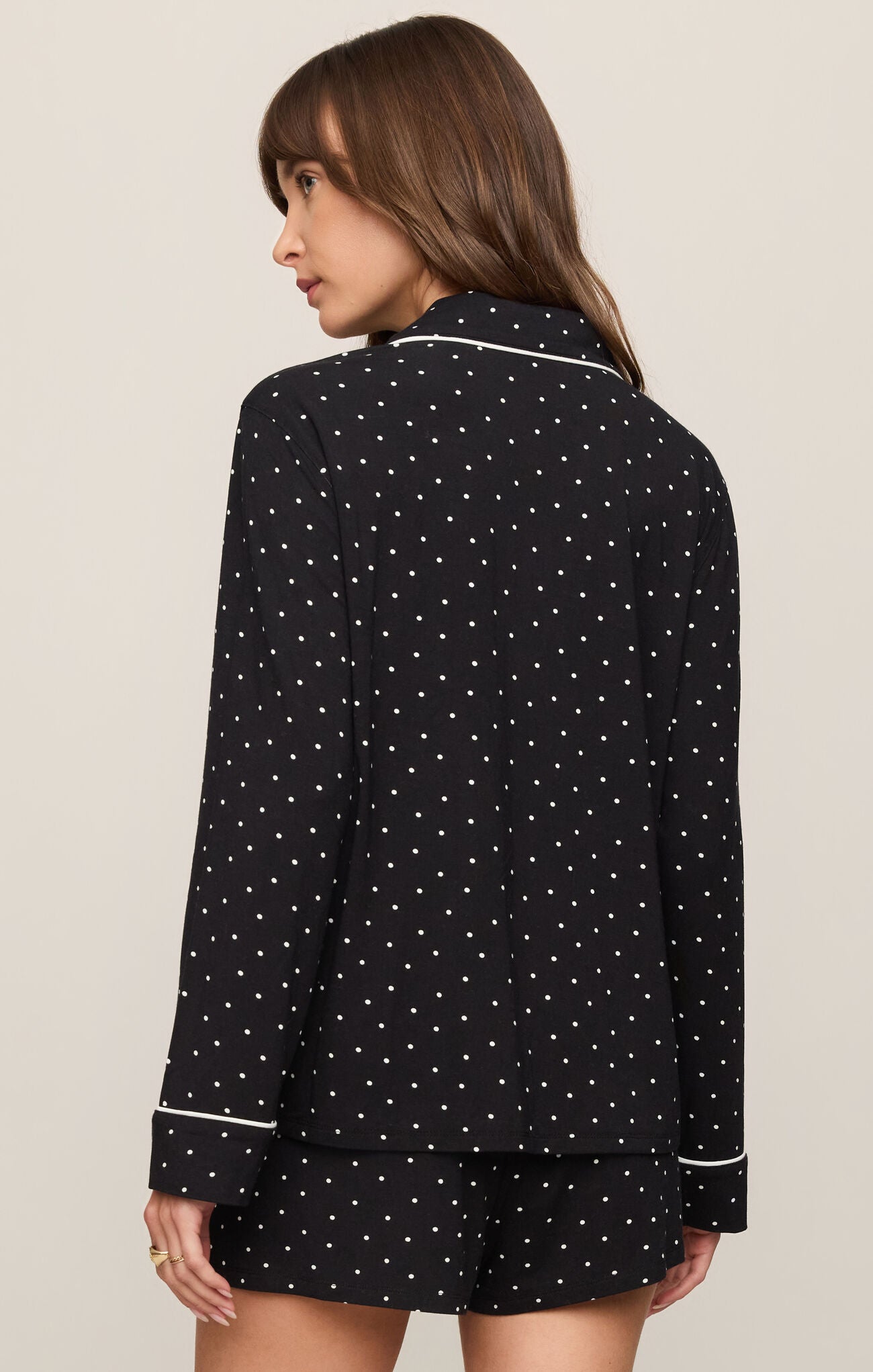Collared Jersey Top combines ultra-soft stretch fabric with a classic button-front design, polished collar, and easy long-sleeve silhouette.