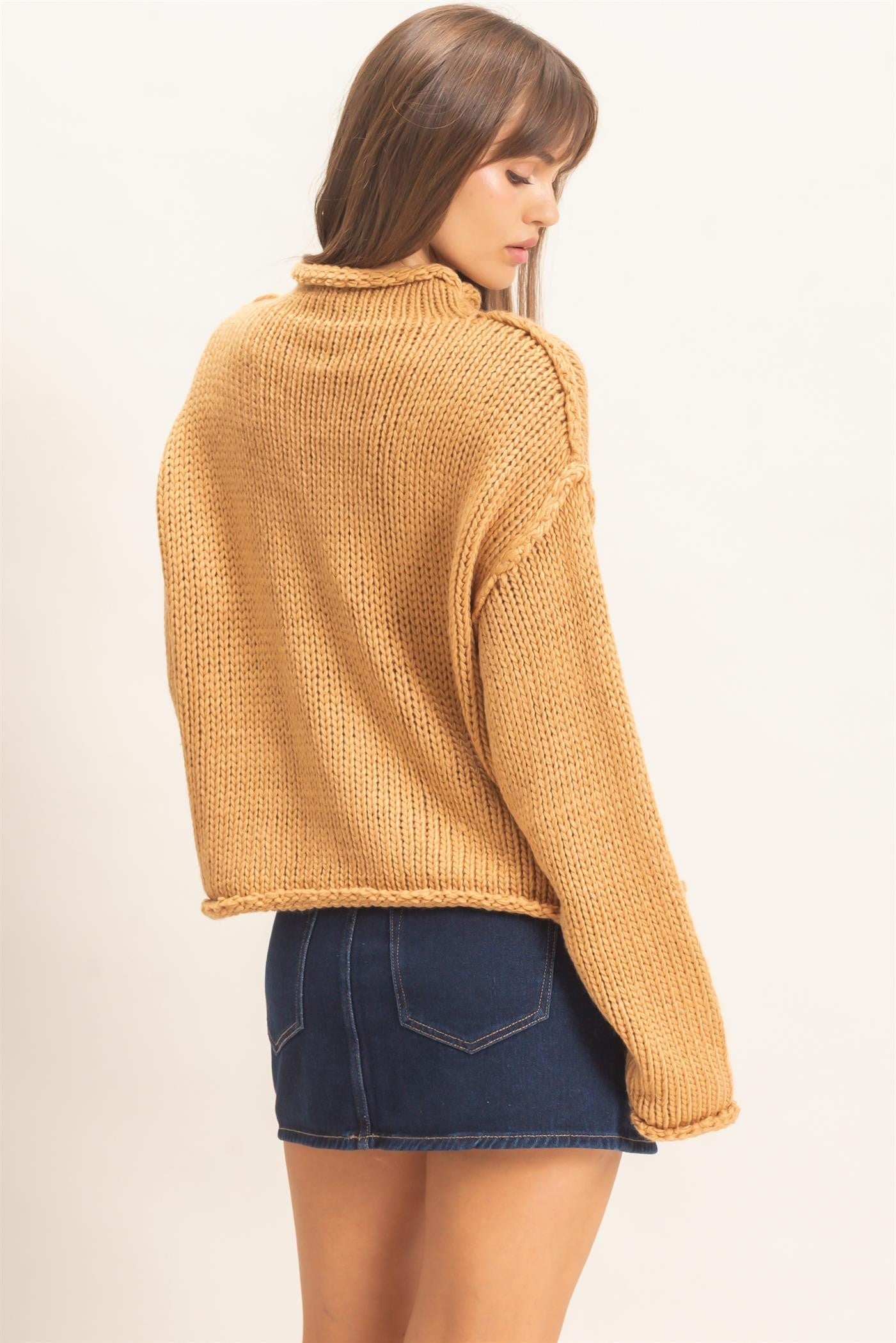 A relaxed loose-knit sweater with a casual rolled collar and dropped shoulders for effortless comfort and everyday style.