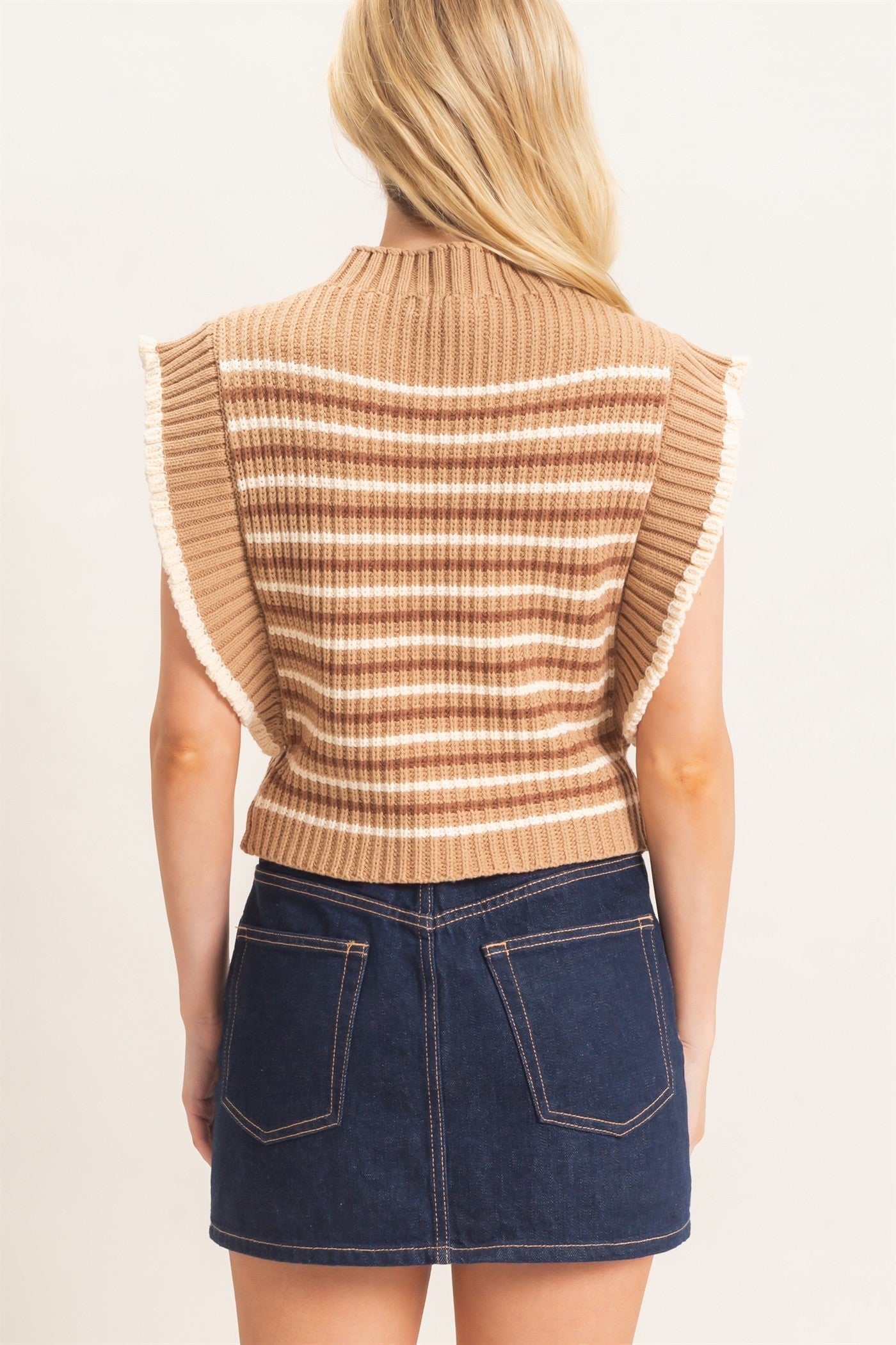 A chic striped ribbed sweater featuring feminine ruffle sleeves, a relaxed fit, and a soft ribbed hem for effortless everyday style.

