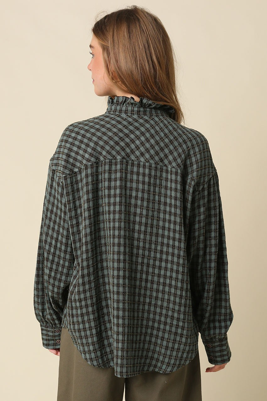 The Hayley Gingham Ruffle Blouse brings timeless charm to everyday style with a relaxed silhouette, romantic ruffle trim collar, and voluminous sleeves.