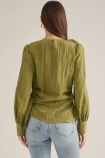 Elevate your wardrobe with this chic long-sleeve blouse featuring a straight neckline, feminine shoulder tie, and flattering side-wrap detail.

