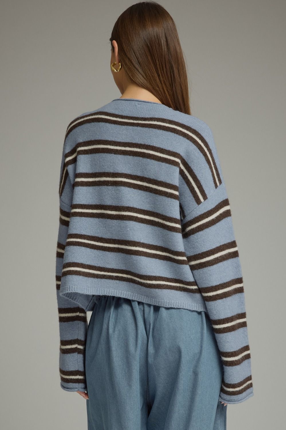 A cozy-chic striped cardigan featuring a classic shirt collar, button-front closure, and soft fuzzy texture for an effortlessly elevated seasonal layer.