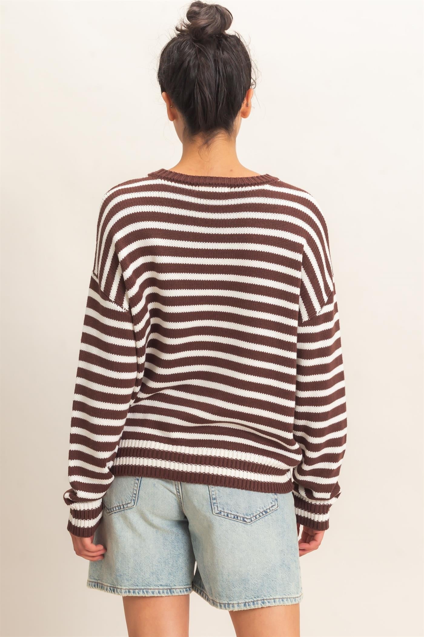 A timeless striped knit sweater featuring a classic crew neckline and relaxed fit for effortless everyday style.